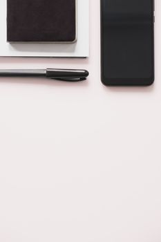 Business flat lay on white background with copy space. Smartphone, writing pen and notebook organizer on minimalistic background