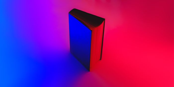 Open book in vibrant blue and red colors. Vivid neon gradients, abstract background image of a book