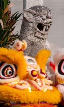 Old lion statue with front lion dance in front of temple at Georgetown World Heritage.