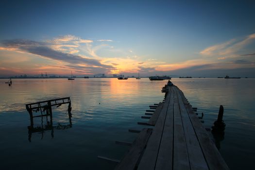 Wooden bridge at Tan Jetty, Georgetown, Penang, Southeast Asia during sunrise hour.