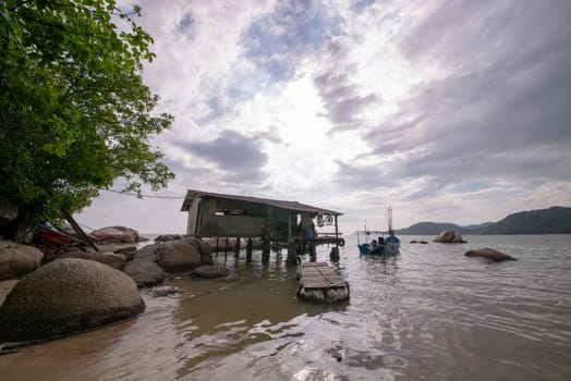 Wooden fisherman hut beside the sea.