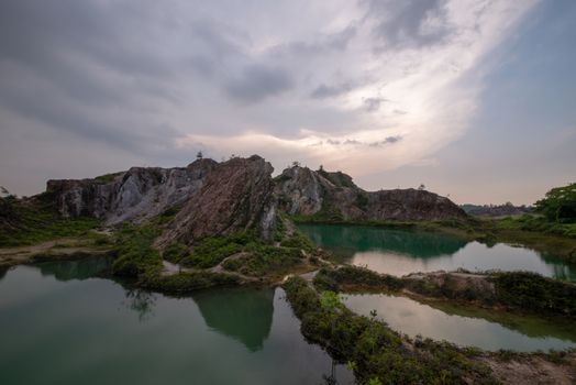 Sunset over turquoise lake at Guar Petai, Penang.