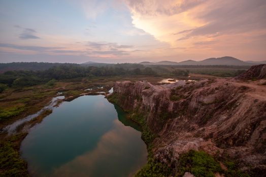 Rock mountain and lake in sunrise morning at Guar Petai, Penang.