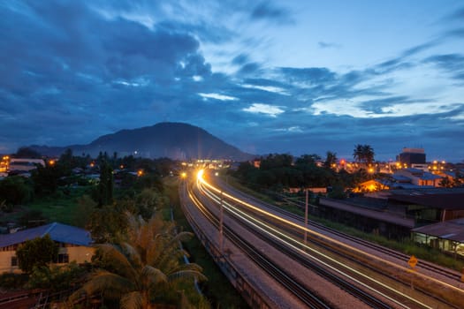 Light trail of KTM train in morning at Bukit Mertajam, Penang.