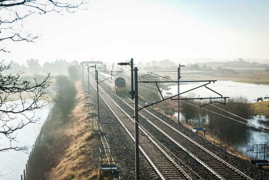 Virgin Train Express passenger train in the countryside UK