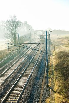 Virgin Train Express passenger train in the countryside UK