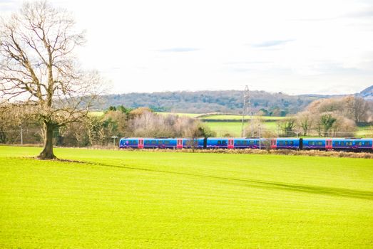 A TransPennine Express passenger train in the countryside