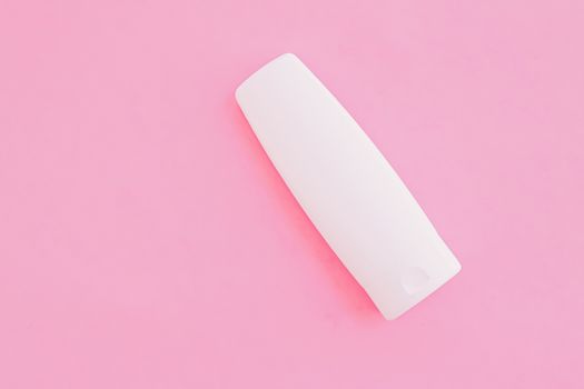 Moisturizing hand cream or body lotion on pink background, beauty product and skin care cosmetics, flatlay