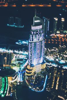 Aerial night view of Dubai in United Arab Emirates, metropolitan cityscape scenery