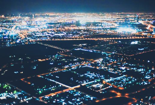 Aerial night view of Dubai in United Arab Emirates, metropolitan cityscape scenery