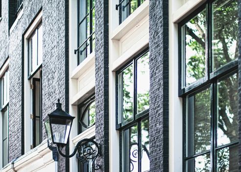 Architectural detail of a building on the main city center street of Amsterdam in Netherlands, european architecture