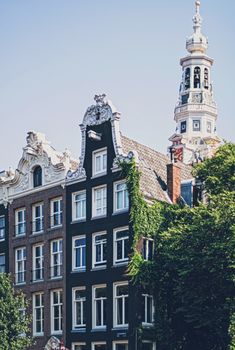 Main downtown street in the city center of Amsterdam in Netherlands on sunny day