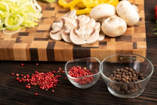 Knife vegetables and spices on a wooden cutting board