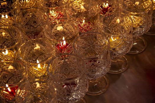 Candle lights in glass at Chinese temple