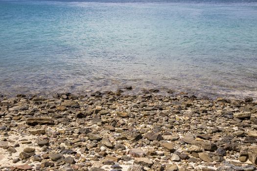 Stones pebble at the coast with sea