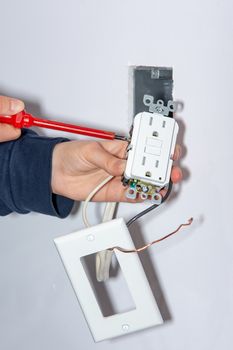 Mounting and installing a wall socket in a box for  drywall