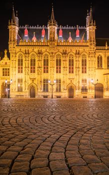 Evening mood with illuminated buildings in the historic city of Bruges, Belgium