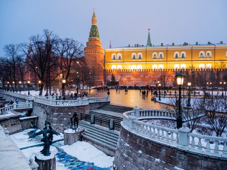 Kremlin towers and Alexander Gardens at winter evening. Moscow, Russia.
