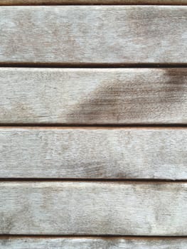 Wooden background of old fence. Shabby texture of wooden boards.