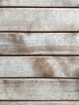 Wooden background of old fence. Shabby texture of wooden boards.