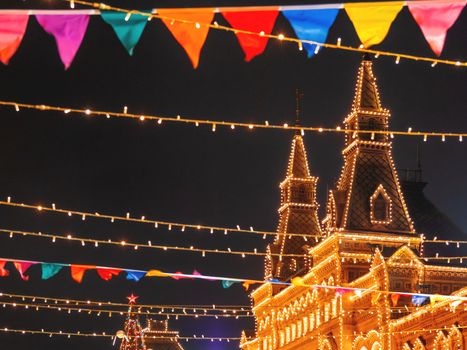 Red Square decorated for New Year and Christmas fair. GUM Main Department Store building with light bulbs. Moscow, Russia.