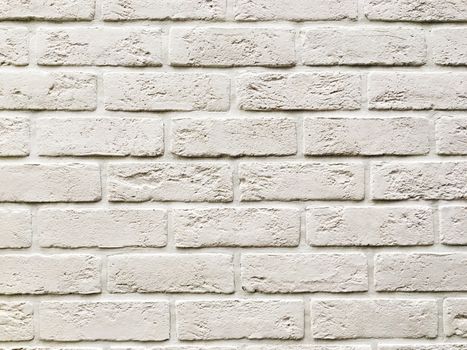 Outdoor wall made of white bricks. Stone texture of building wall.