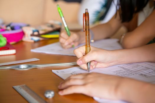 girl doing her school work with online class