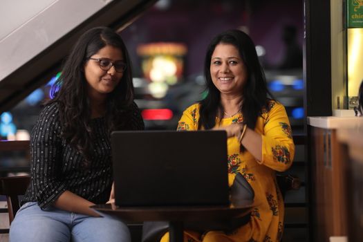 Female Employs with Computer in a office