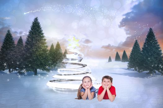 Composite image of cute children against snowy landscape with fir trees