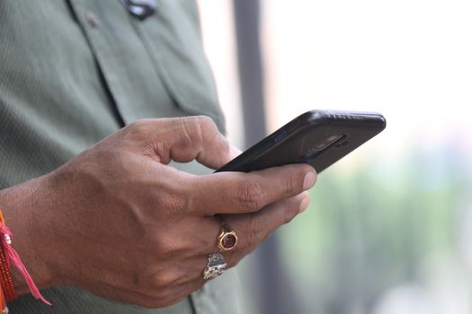 Male Model hands with cell phone