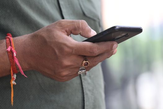 Male Model hands with cell phone