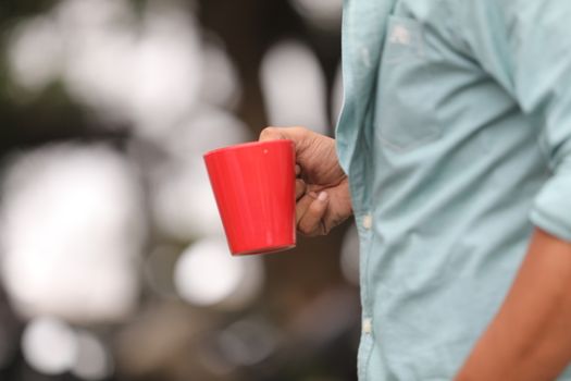 Male hand with cup