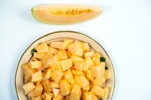 Small pieces of cantaloupe in the ceramic plate