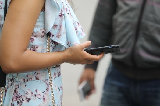 Female hands with cell phone