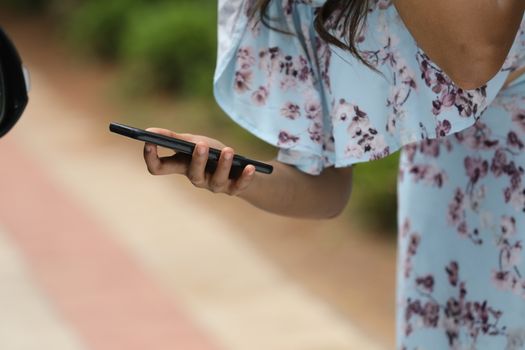 Female hands with cell phone