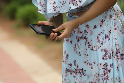 Female hands with cell phone