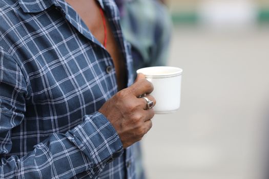 Male hand with cup