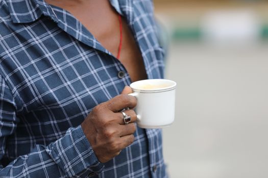 Male hand with cup
