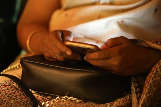 Female hands with cell phone