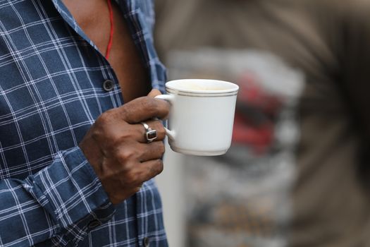 Male hand with cup