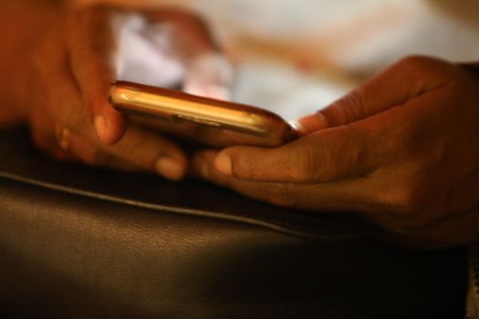 Female hands with cell phone