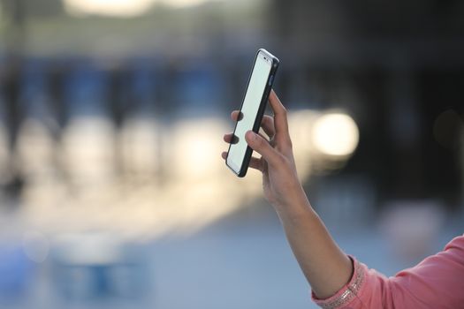 Female hands with cell phone