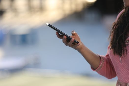 Female hands with cell phone