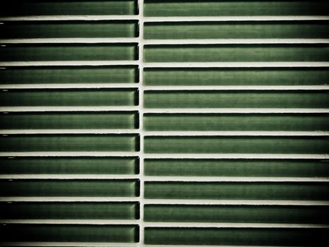 The texture of green ceramic tiles wall