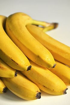 Bunch of raw ripe organic yellow bananas