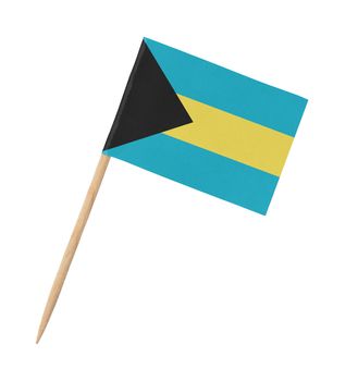 Small paper flag of Bahamas on wooden stick, isolated on white