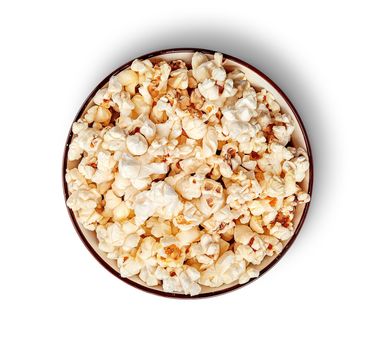 Popcorn in bowl top view isolated on white background