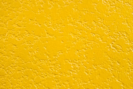 Texture of high detail painted concrete wall / Yellow colored background