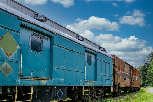 An old abandoned railroad train on tracks