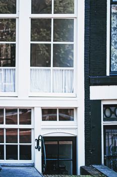 Architectural detail of a building on the main city center street of Amsterdam in Netherlands, european architecture